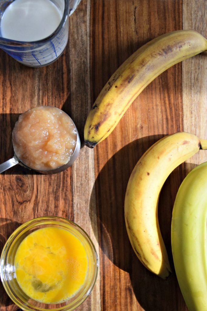 Ingredients for a healthy, flavorful banana bread include bananas, applesauce, milk and eggs