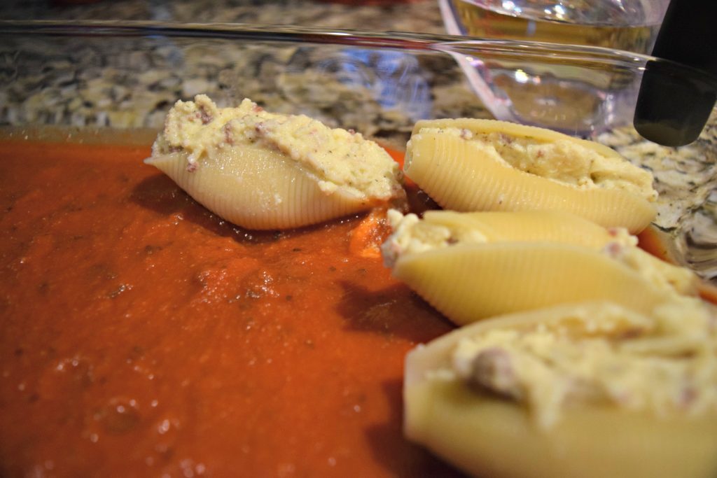 Cooked shells stuffed with creamy, cheesy filling