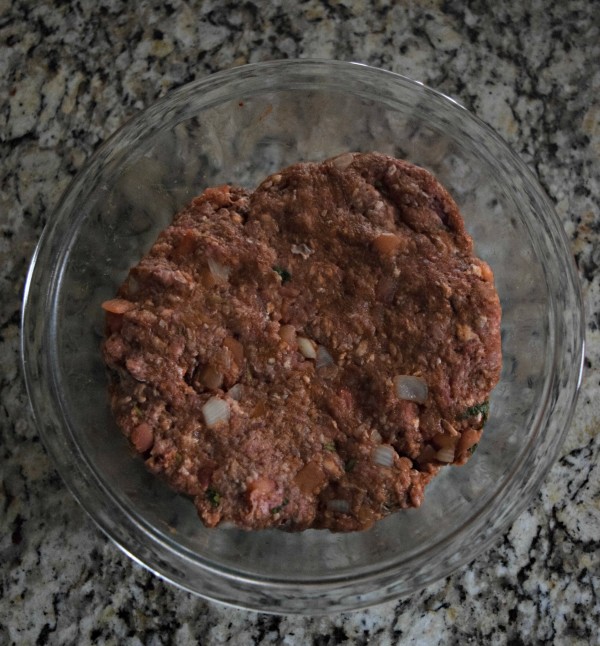 The ground beef has taco seasoning, onions, and tomatoes mixed in, making it the perfect patty for these taco burgers