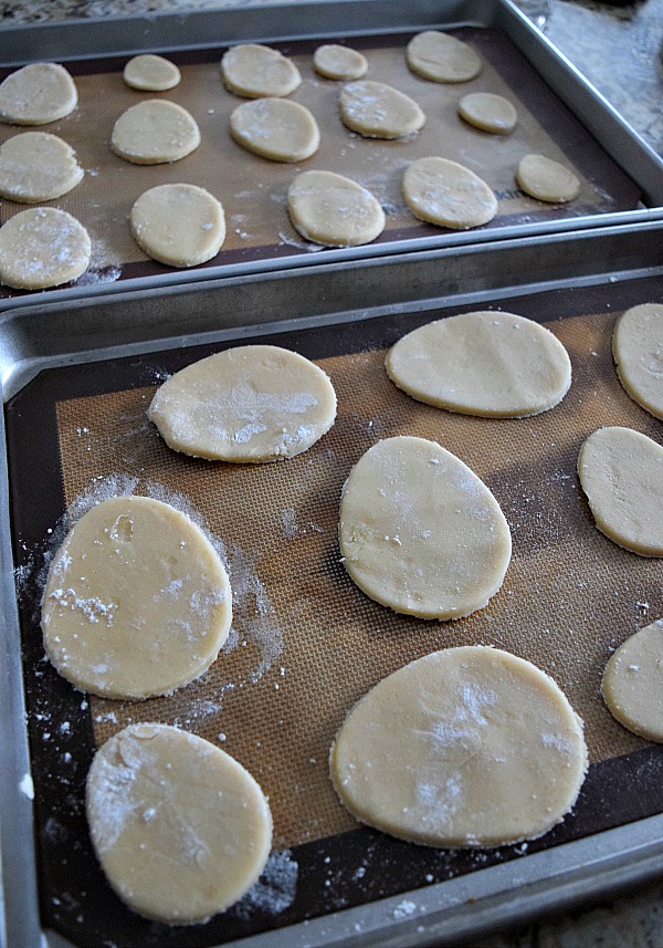 Line your Easter egg sugar cookies up on baking trays and get ready to bake them!