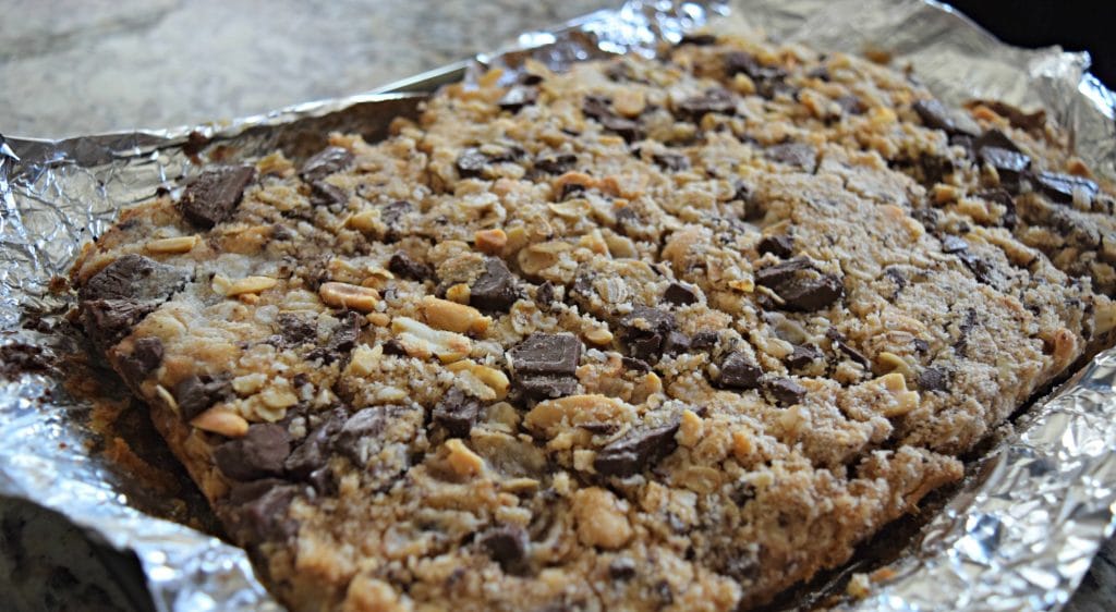 Peanut Butter & Chocolate Chunk bars! Perfect for a salty and sweet treat! Click to see the recipe!