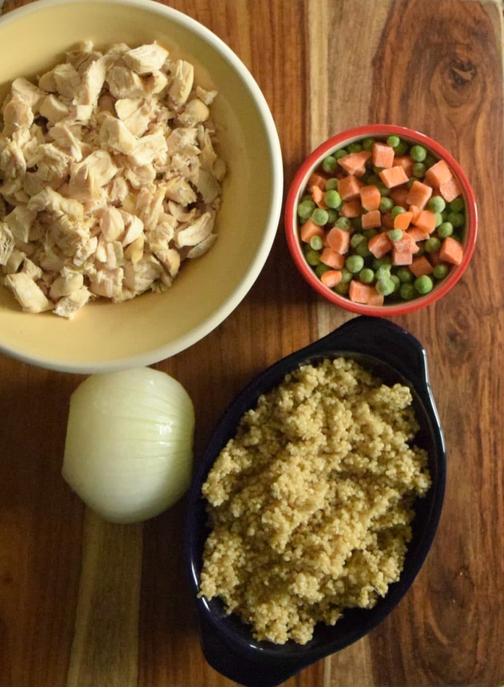 You need chicken, quinoa, and veggies to make this cream chicken and quinoa casserole