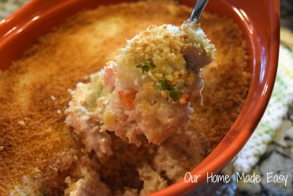 Creamy chicken casserole with tender veggies and quinoa is topped with breadcrumbs and baked to perfection