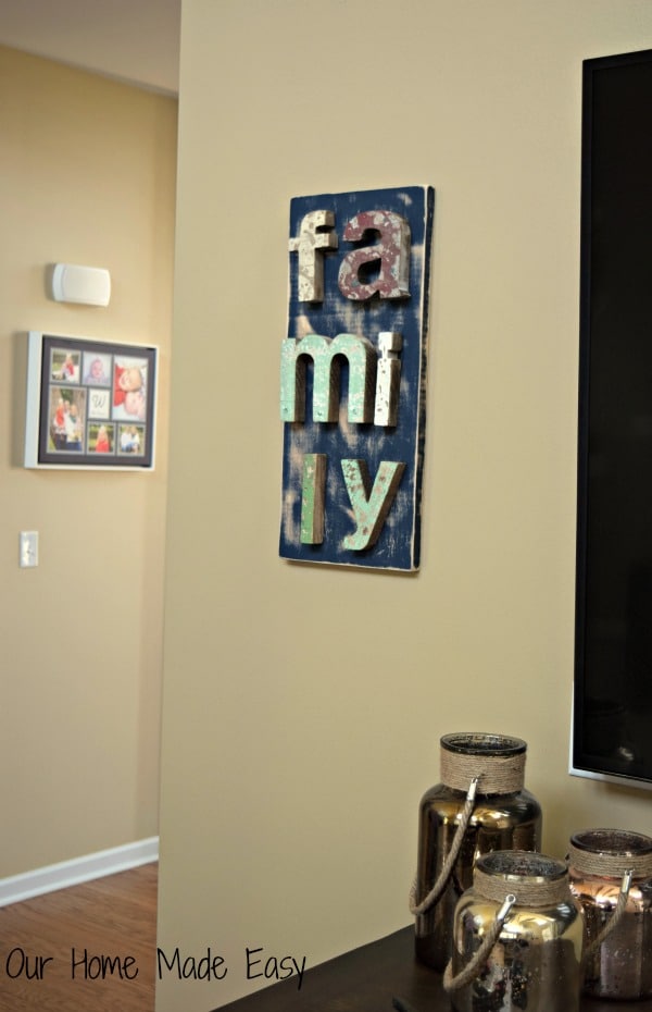 I hung our family wood sign next to our TV in the living room, and it's the perfect addition to the room