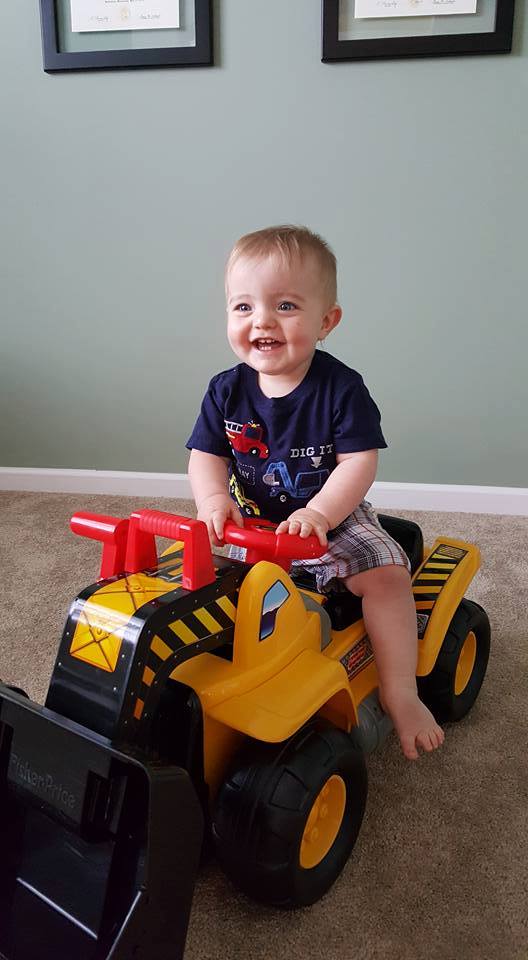 Own loved his new construction truck present at his very own construction themed 1st birthday party