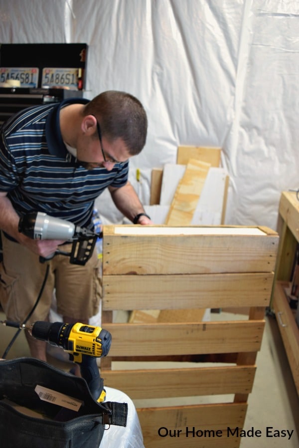 The first step in building this pallet wine rack is to take apart the large warehouse pallet.