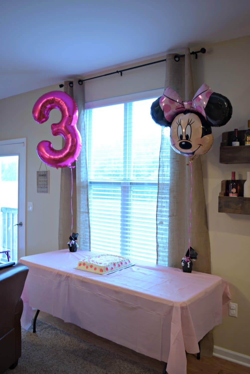 Minnie Mouse balloons and a dun pink polka dot cake are perfect for our Minnie Mouse Birthday Party 