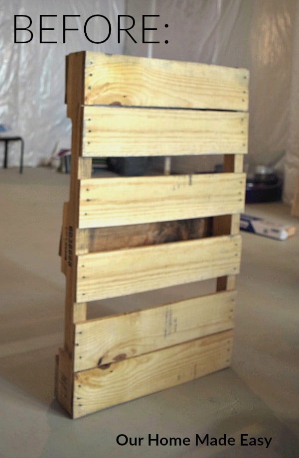 Use a basic warehouse style pallet and transform it into a wood wine rack