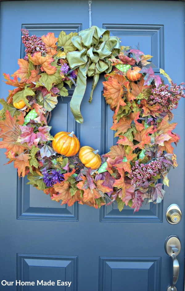 Bring a lot of color into a small space by including a bright seasonal wreath in your front porch decor