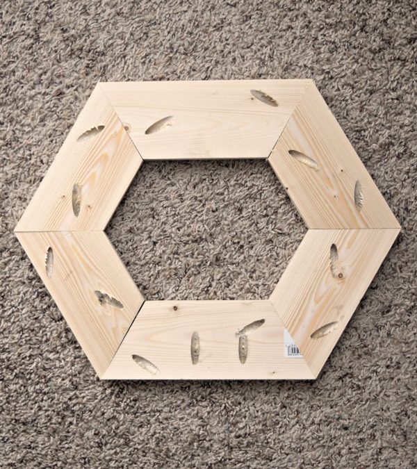 Assemble the pieces of wood in a hexagon shape