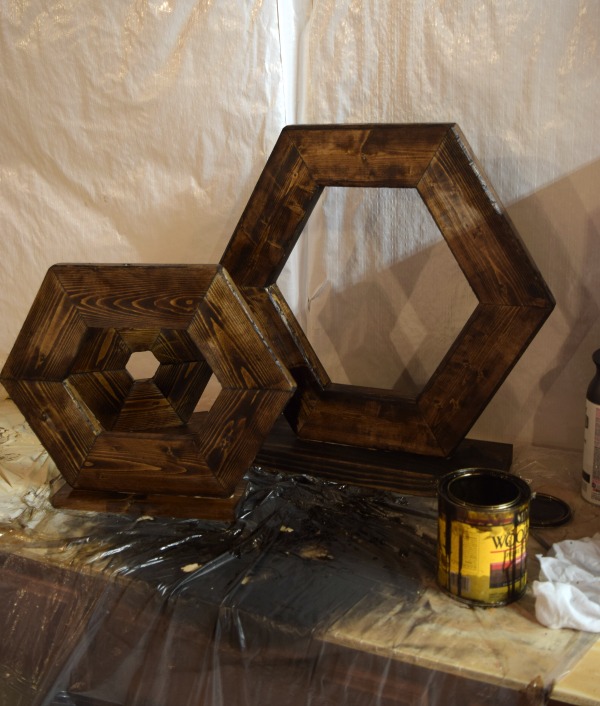 stain the hexagon wooden pumpkins with a stain color of your choice. We went with dark chestnut brown