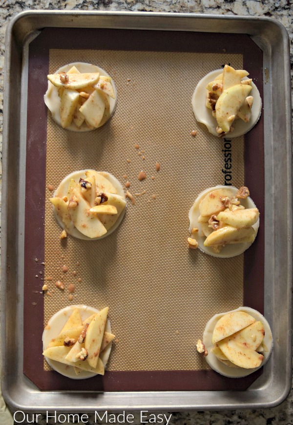 Stack the apples on the pie crust circles and prepare for baking