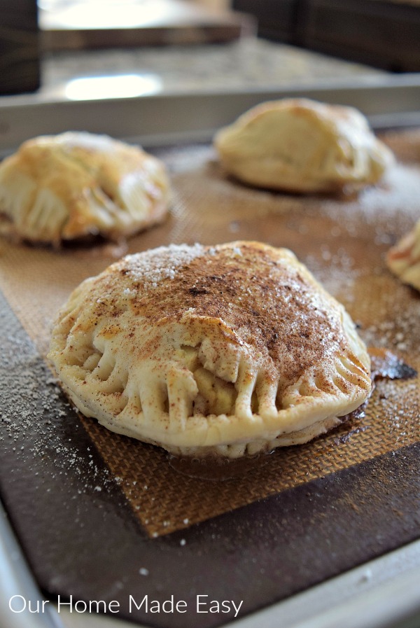 These delicious apple hand pies are topped with cinnamon sugar and baked to perfection