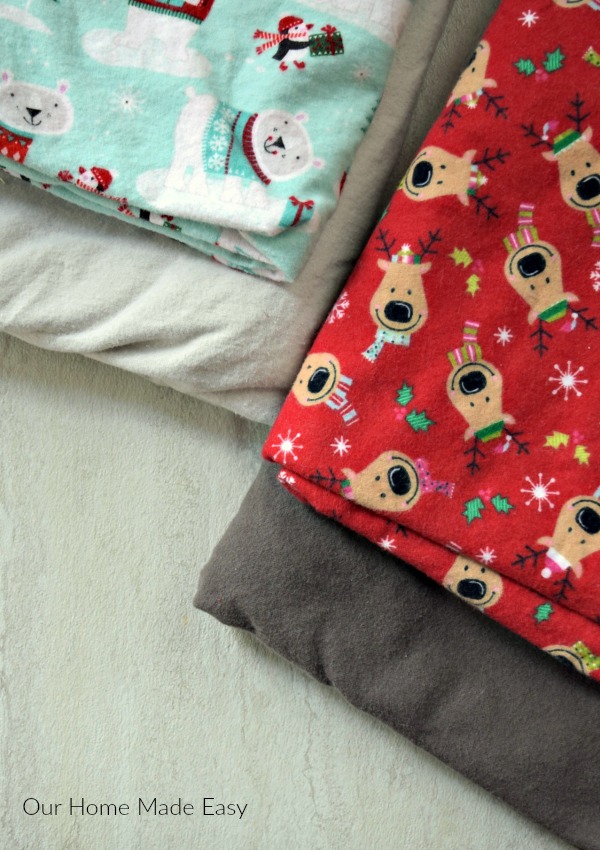 We made these cozy diy flannel blankets right around the holidays, so we used fun Christmas flannel fabric 