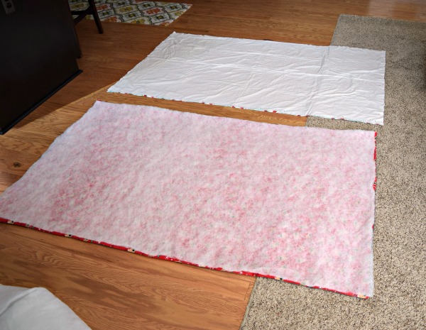 Measure out the batting insert for your diy flannel blanket, making sure it's the perfect size