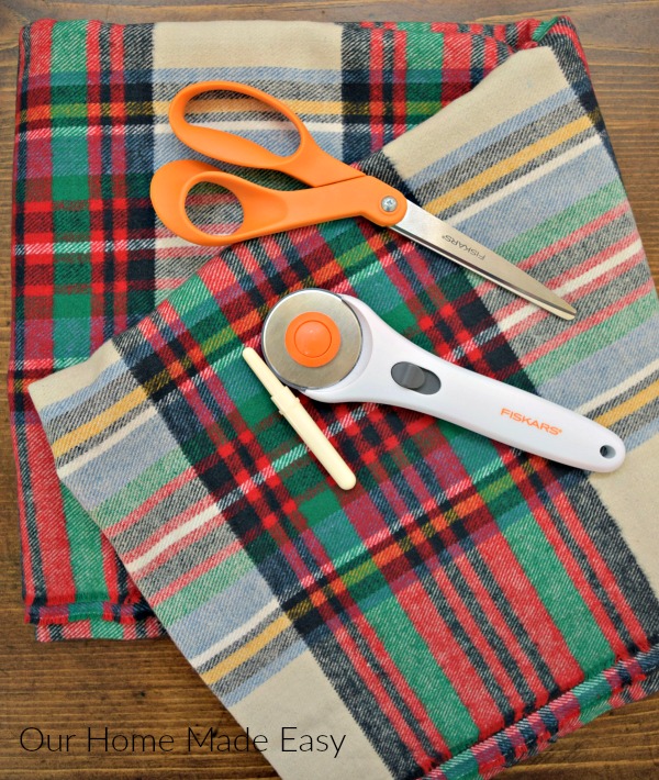 An easy how-to in making your own $5 flannel blanket scarf! Click to see how easy it is to make!