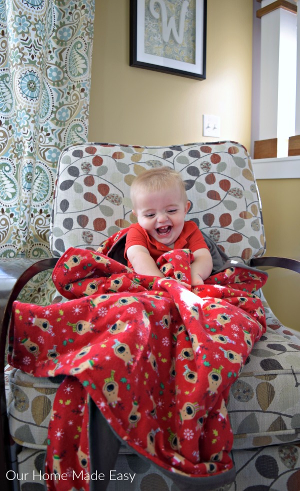 a soft flannel kids' blanket with reindeer and christmas lights