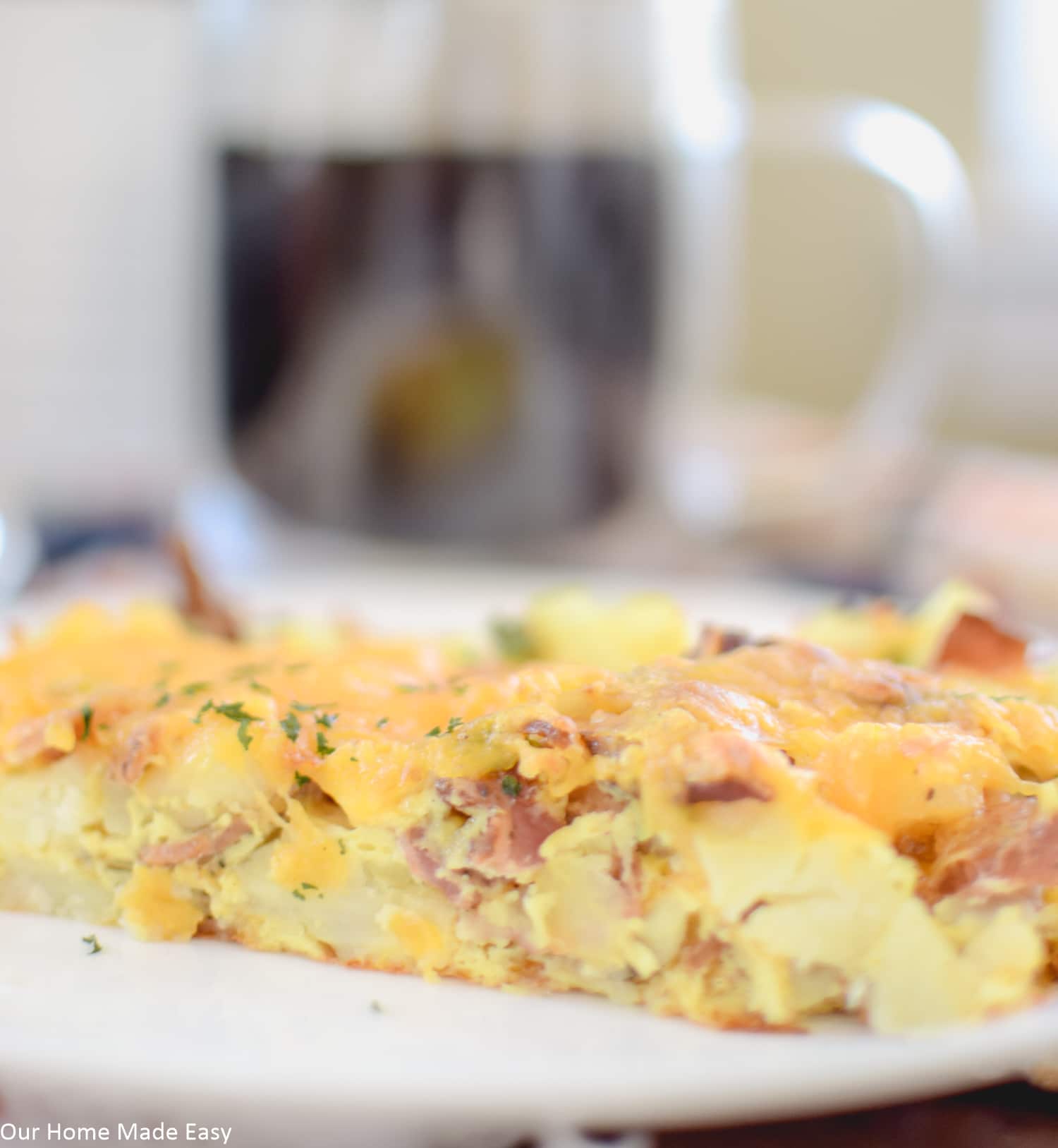 layers of cheese and fluffy eggs with bacon and sausage is a simple breakfast casserole