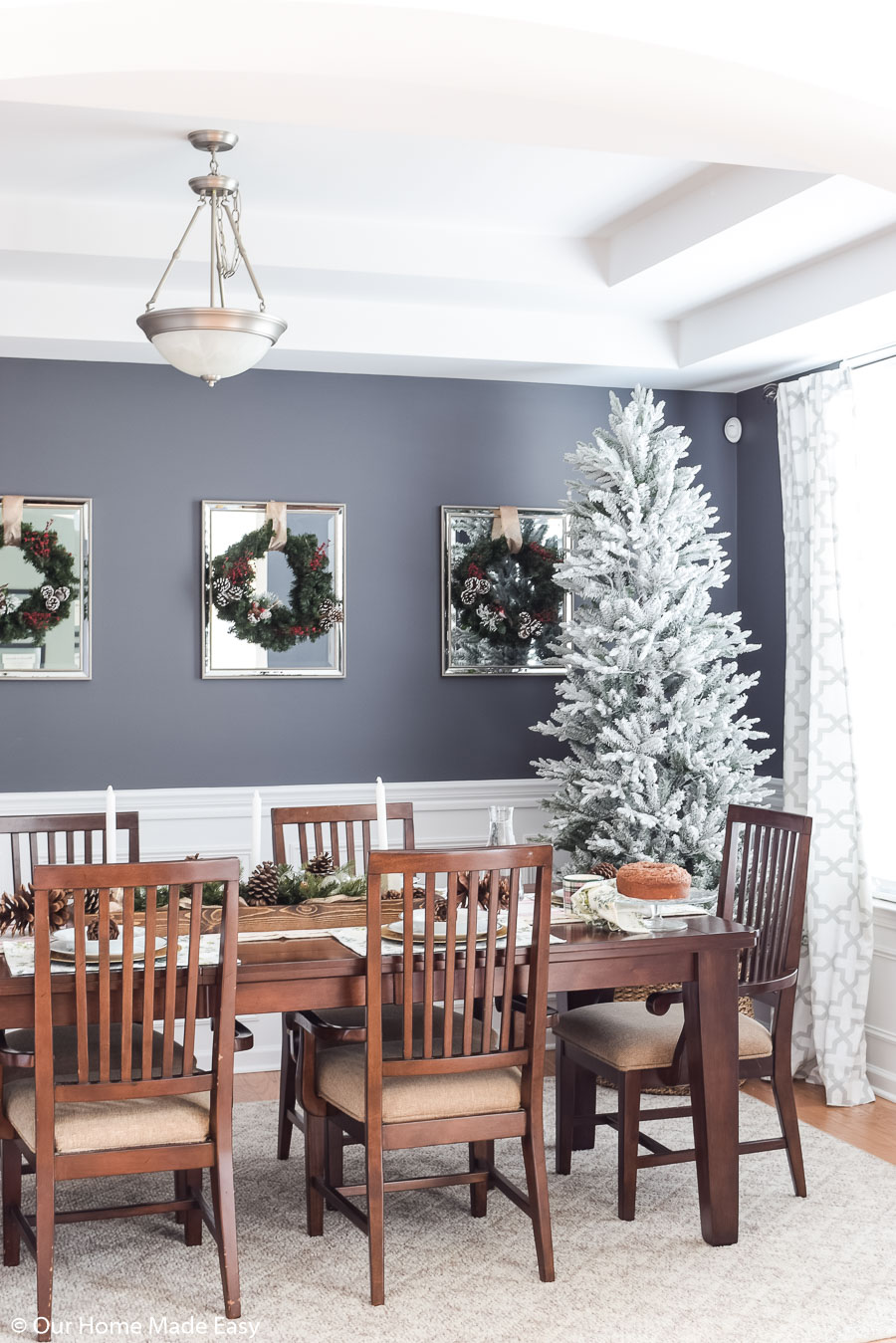 The simplicity if our Christmas dining room decor is bright and festive