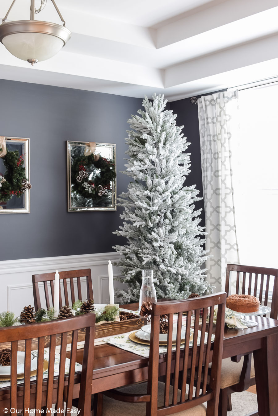 Our Christmas dining room is simple and clean. We love our white frosted branch Christmas tree!