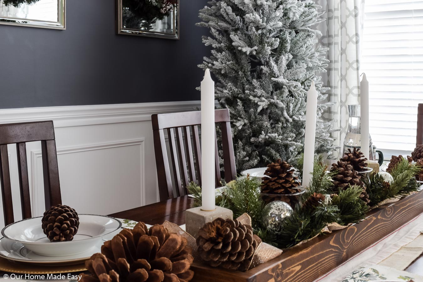 Candlesticks are a perfect addition to our Christmas dining room table centerpiece