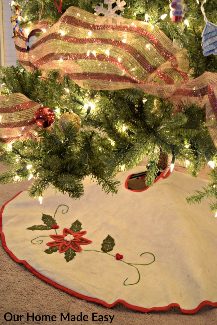 See how we decorated our 12-foot Christmas tree with ribbons, lights, and an embroidered tree skirt