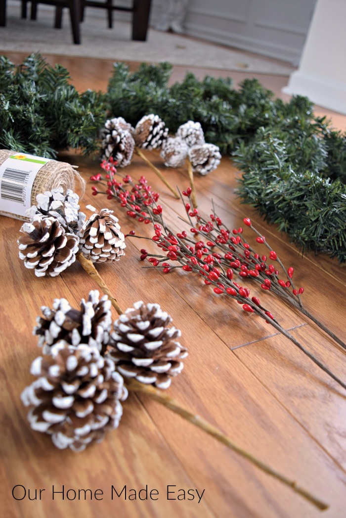 Holly berries and pine cones are the perfect additions to a DIY Christmas wreath