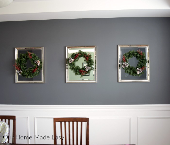 I hung each of my DIY Christmas wreaths on a mirror in our dining room