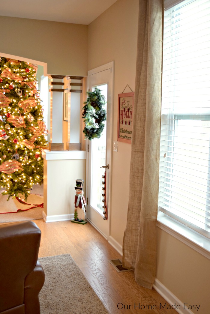 Greenery is the theme of this simple, cozy Christmas decor--with simple wreaths and Christmas signs