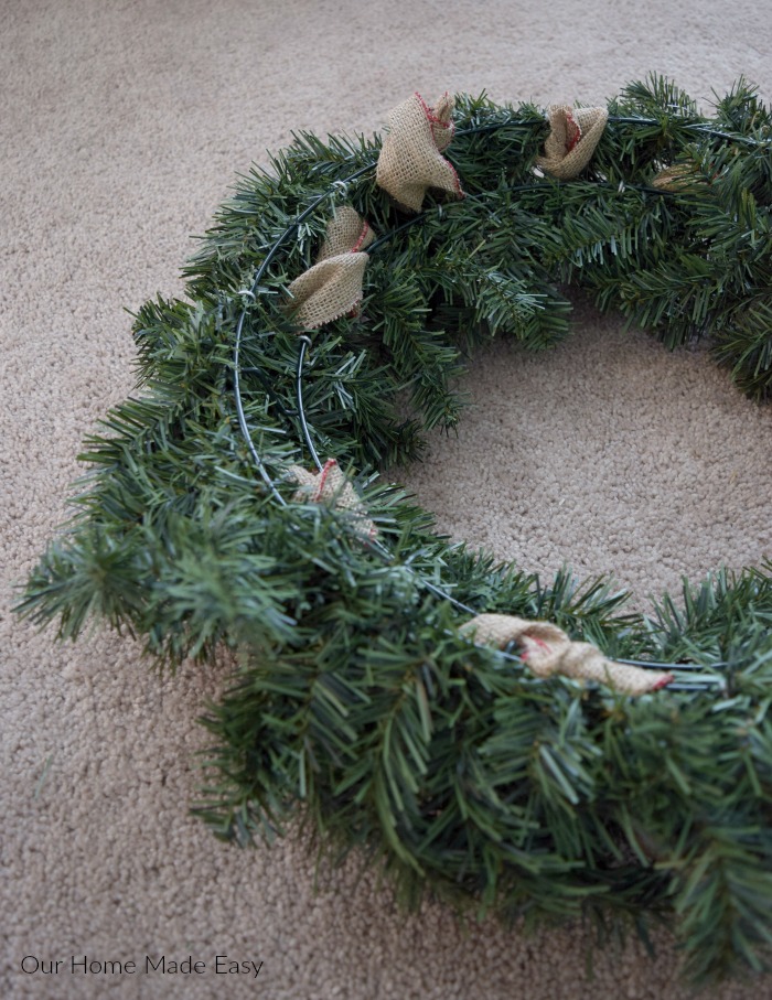 This is what the wreath looks like from the back, with burlap ribbon woven through the branches