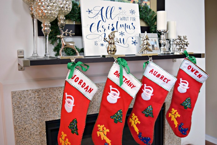 If you don't have a fireplace mantle, you can simply hang a shelf and decorate it with your family stockings