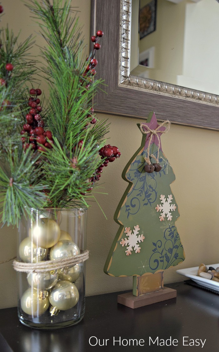 Our cozy Christmas decor is warmed up with festive Christmas greenery and ornaments