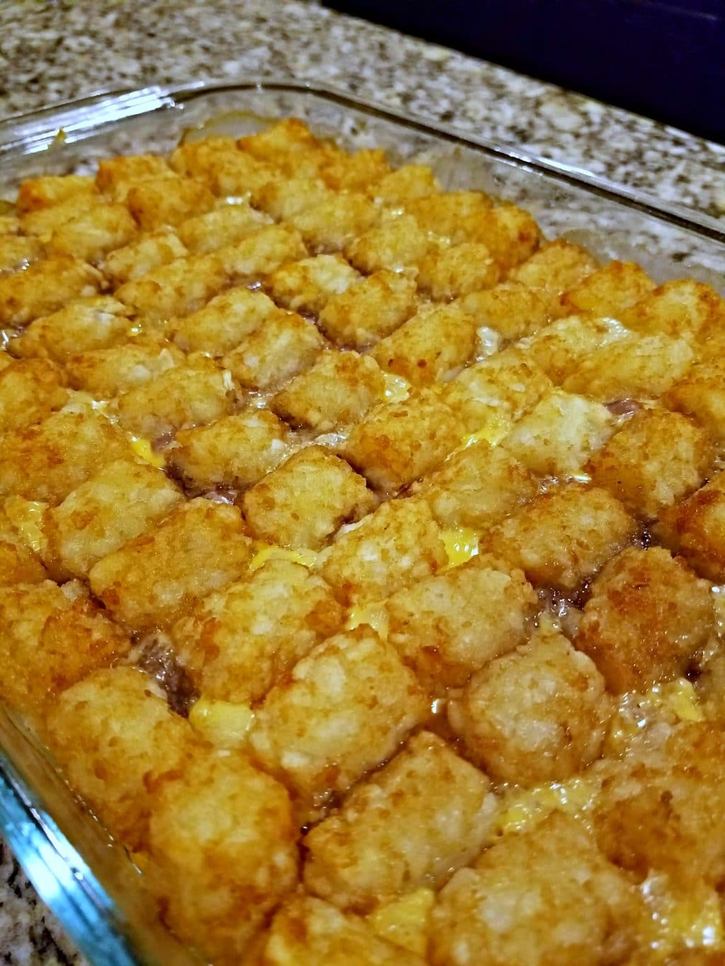 This tater tot casserole has a layer of ground beef topped with creamy mushroom soup, melted cheese, and crispy tater tots