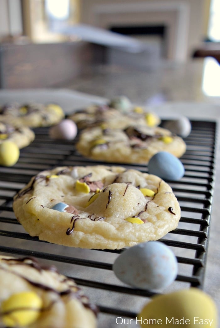 These 3-ingredient sugar cookies have creamy cadbury eggs, sprinkles, and drizzled with chocolate