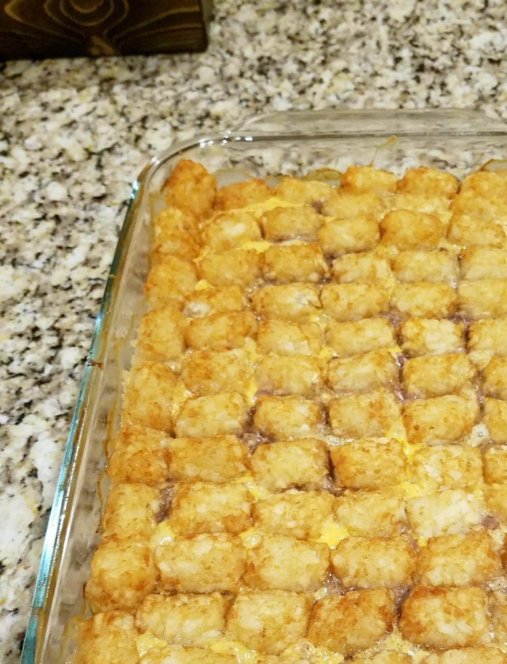 This easy tater tot casserole just calls for three main ingredients--tater tots, ground beef, and cheese! Customize it with your favorite add-ins