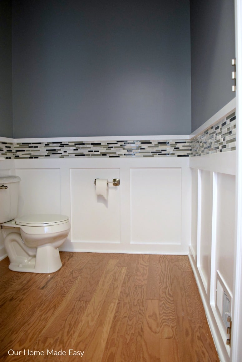 Here is how we easily added accent mosaic tile around our powder room! It made such a huge difference, and it was an easy DIY. Check out the AFTER!