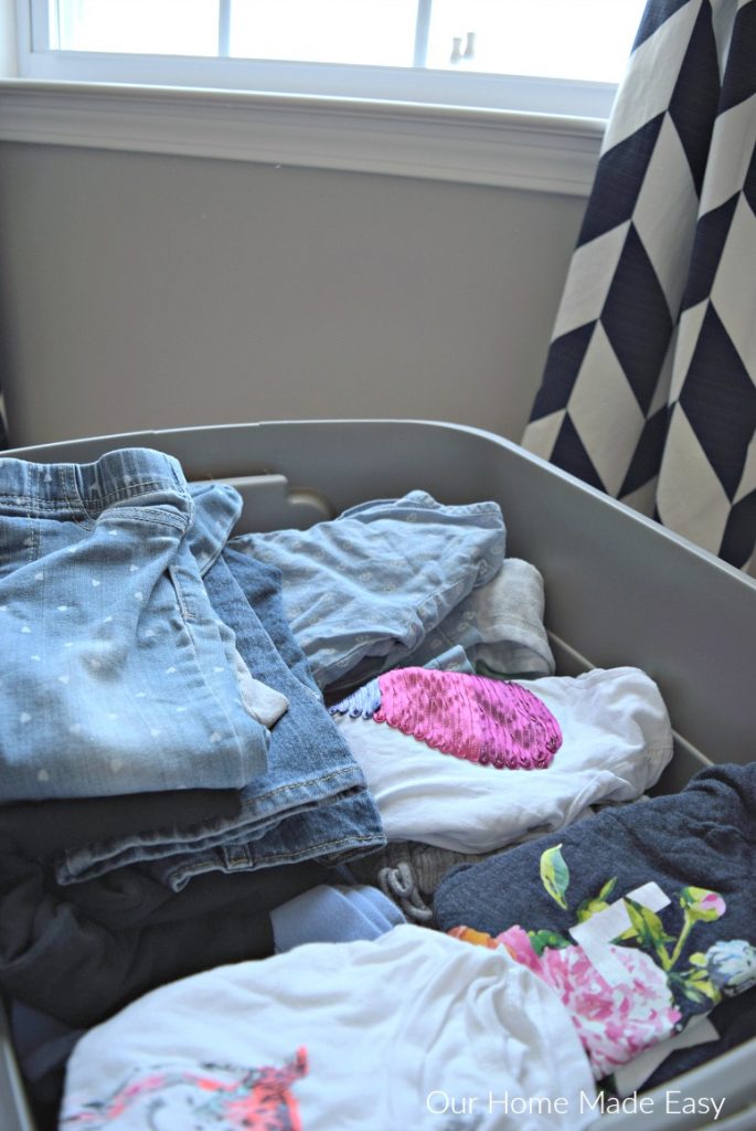 Keep empty totes in your kids' rooms and fill them with clothes that they no longer wear or fit