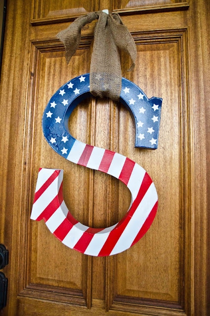 spruce up your front door with some patriotic flair with this red, white, and blue letter