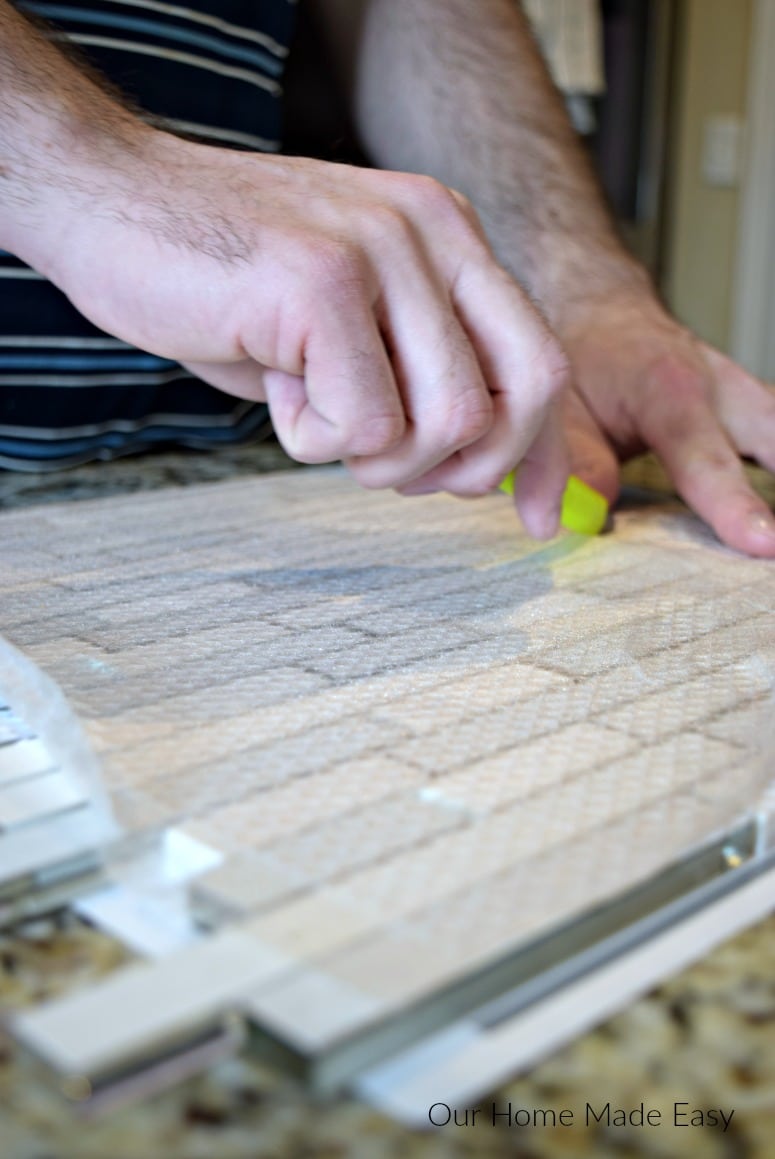 Here is a tutorial on how to install a tile backsplash even if you've never done it before! Use these easy tips to add beautiful tile work to your home.