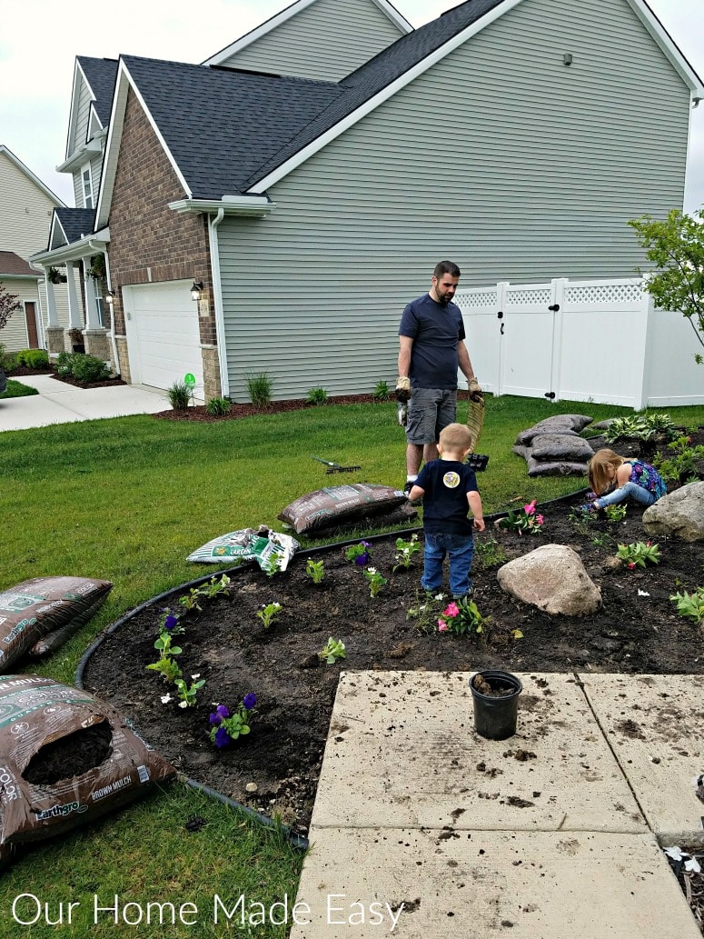 Our whole family was out in the sunshine updating our summer flower beds with fresh foliage