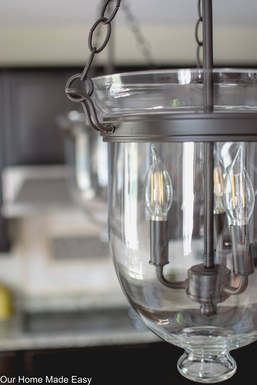 The new kitchen island pendant lighting is bright and clean 