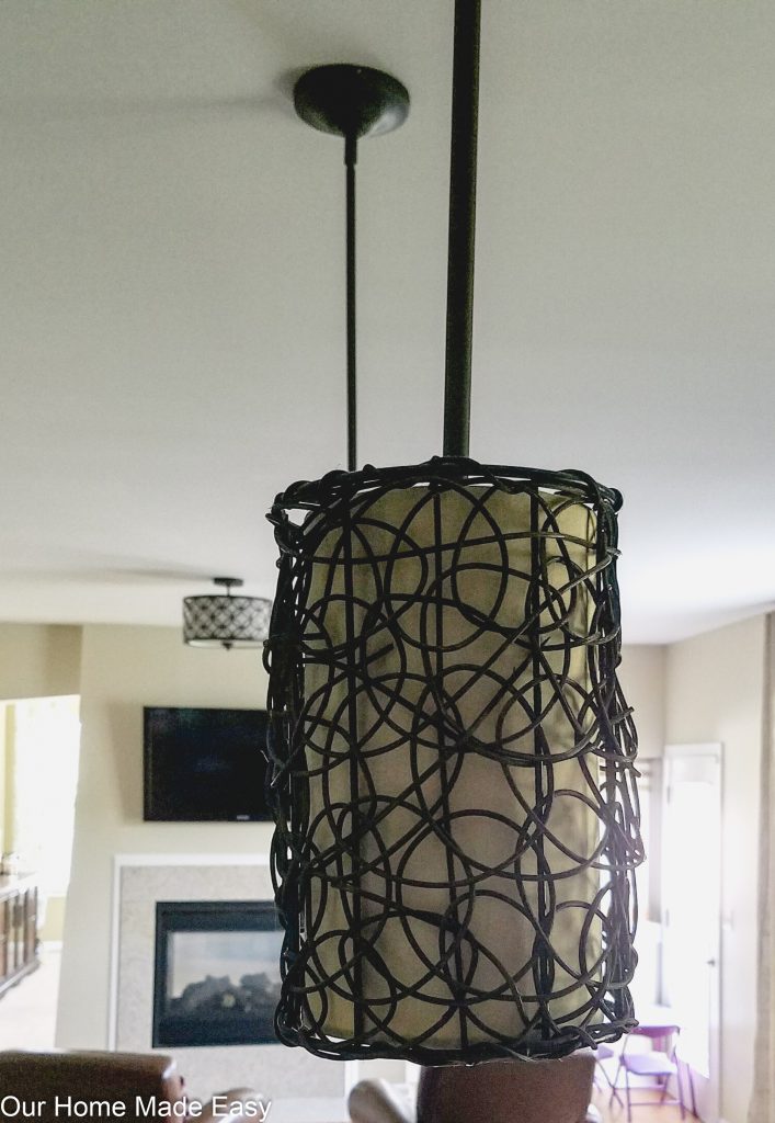 Our old kitchen island pendant lighting was dark and didn't fit with the rest of our kitchen design