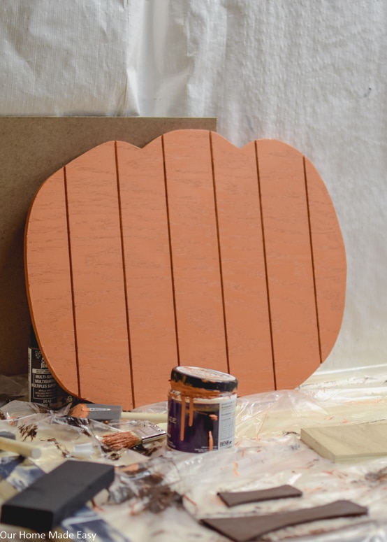 You can paint your plywood pumpkins to fit your fall decor--we used a harvest orange color on this pumpkin