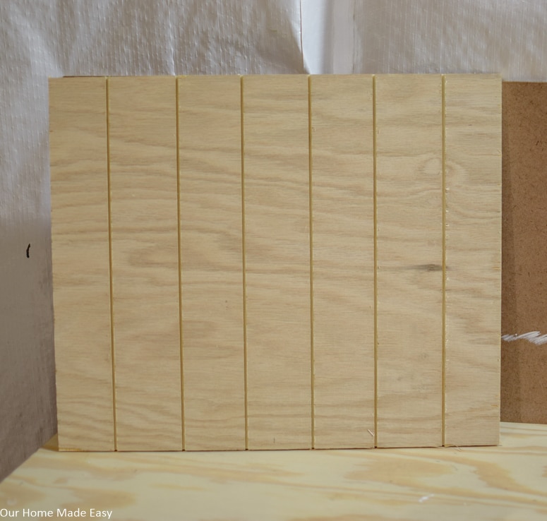 Use a table saw to cut grooves into the plywood to resemble grooves in the surface of a pumpkin