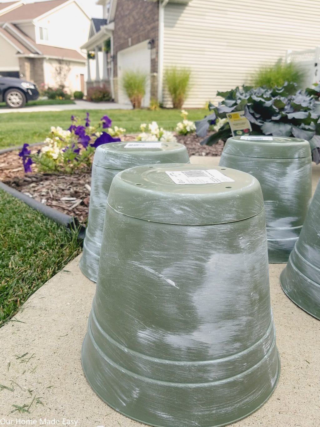 Apply the paint to the planters lightly, making it look rustic and aged