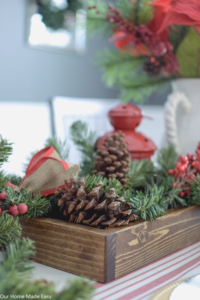 This DIY wood tray is perfect to use as a decorative centerpiece for holiday decorating