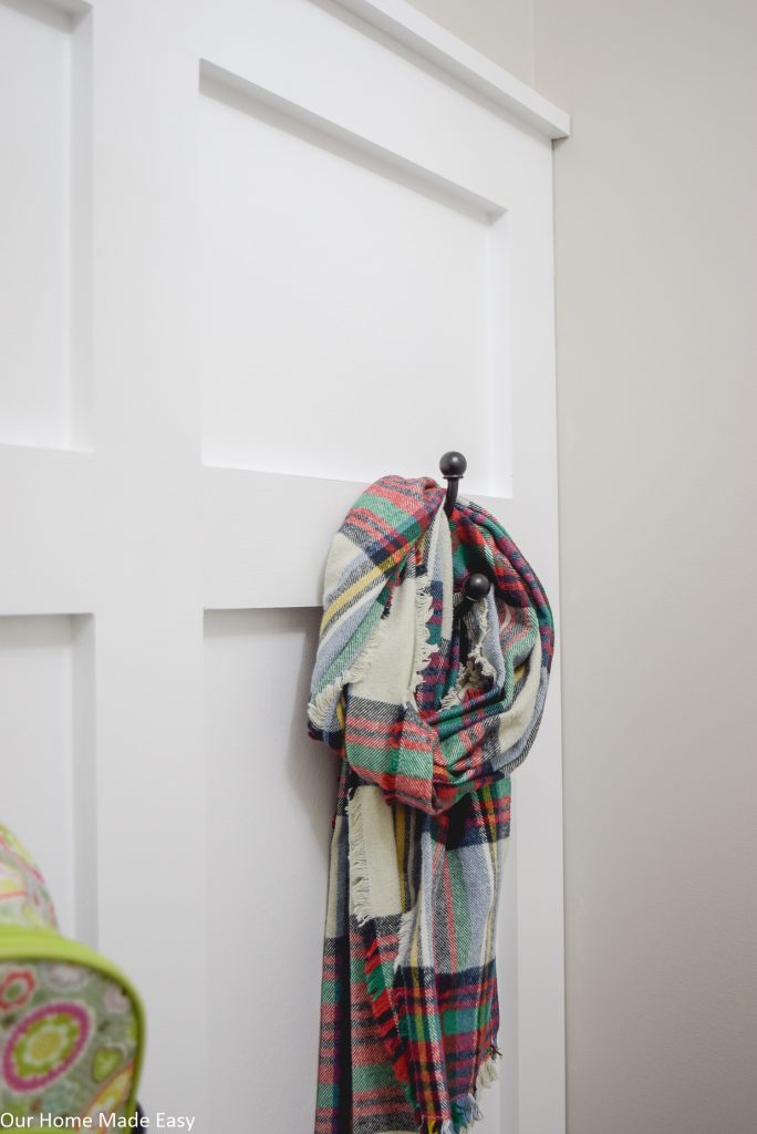 Coat hooks make it easy to keep scarves and jackets off the floor