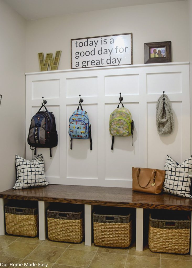 A built-in bench and storage area gave our mudroom much needed space to store things