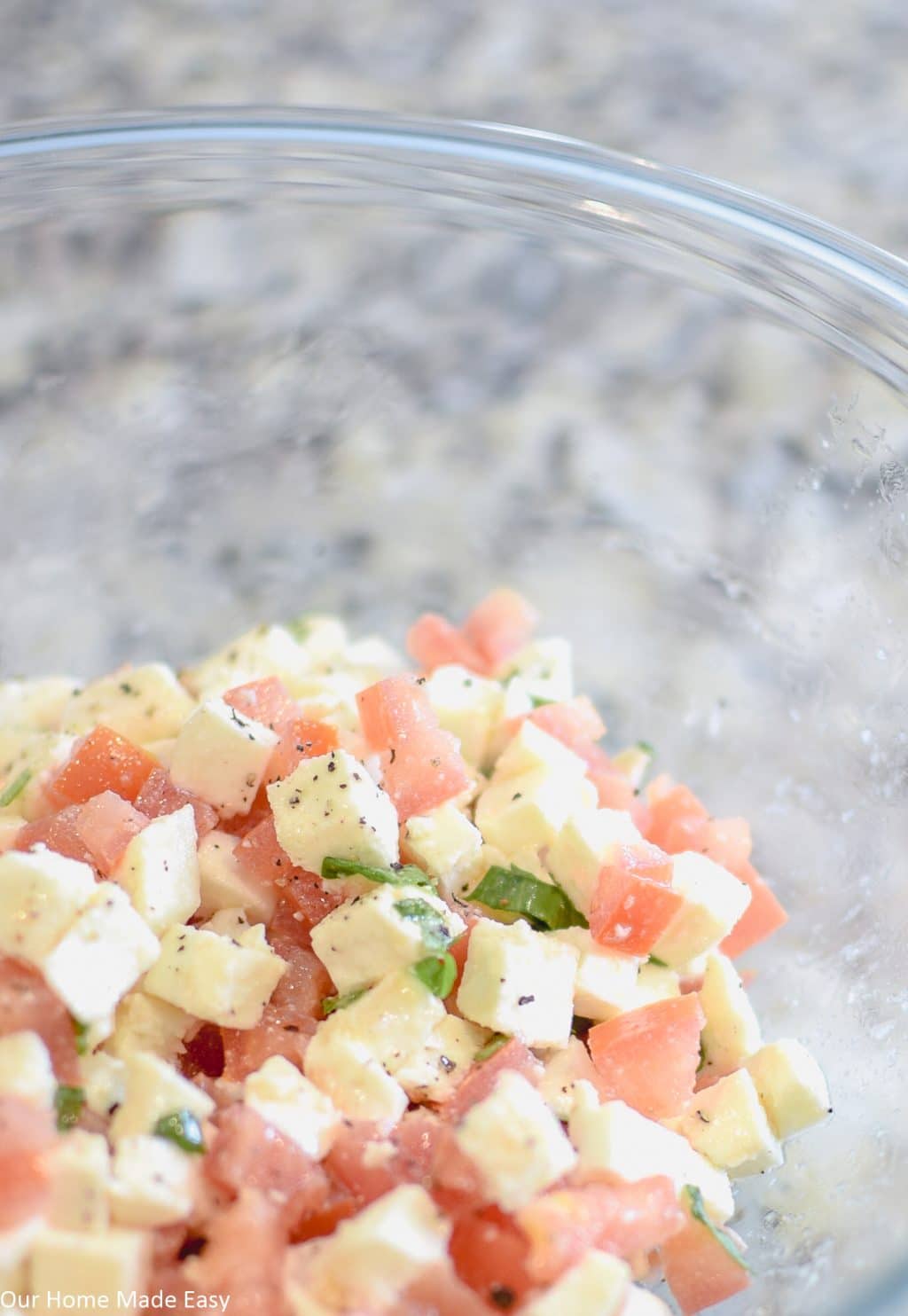 Fresh mozzarella cheese mixed with diced tomatoes and basil