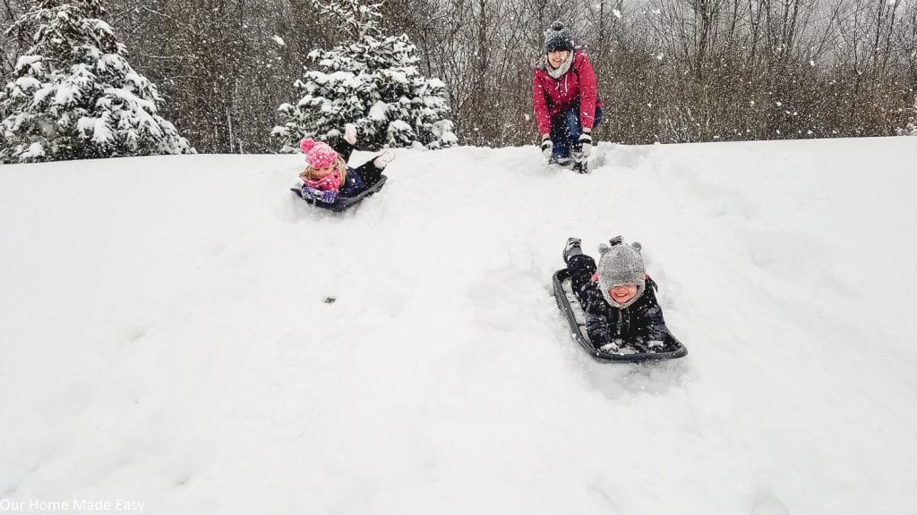 The kids enjoying some sledding on a snowy afternoon in Michigan